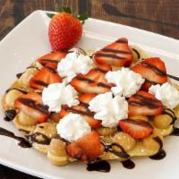 Strawberry Whip Waffle · Bubble waffle, sprinkled powder sugar, fresh strawberries, chocolate drizzle and whip cream.