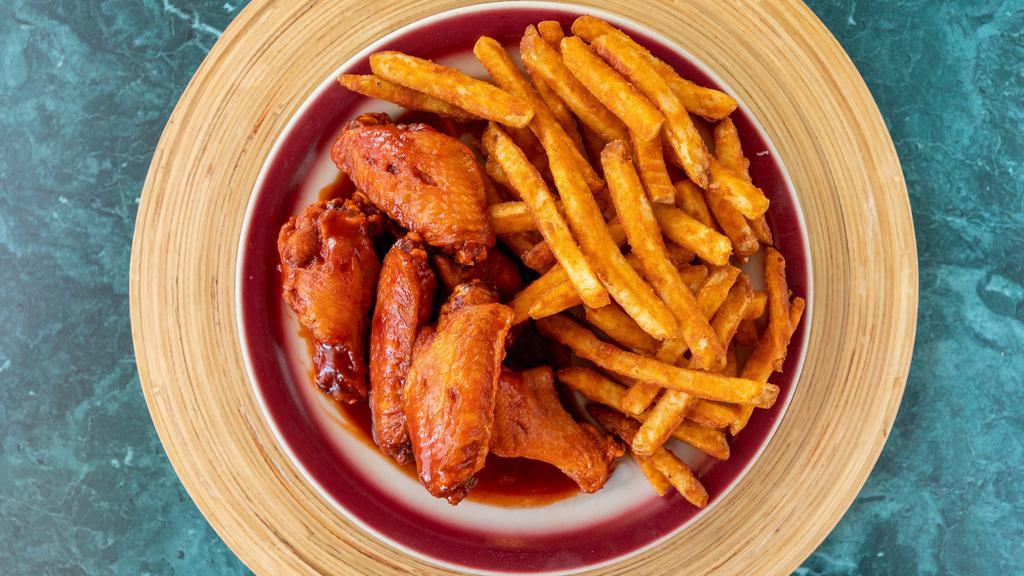 Hot Wings With French Fries · Cooked Chicken Wings coated in Hot Sauce with a side of French Fries.