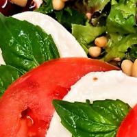 Caprese Salad · Mozzarella, balsamic reduction, plum tomatoes.