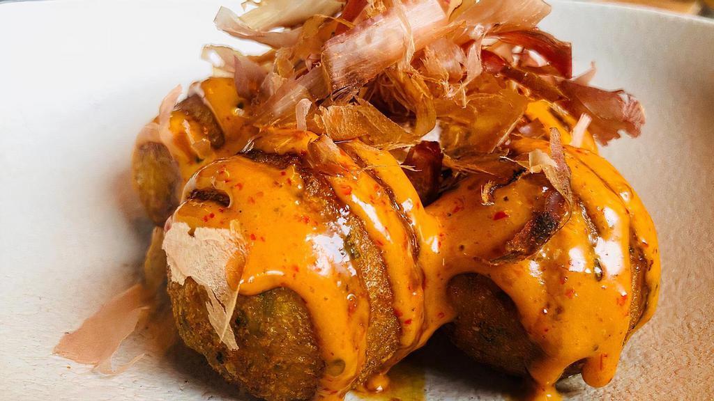 Takoyaki (5 Pcs) · Japanese snack of savory ball-shaped cakes contains chopped octopus, made from wheat. (Fried) served with eel sauce, spicy mayo and topped bonito flakes.