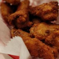 Wing Dings · 10 Chicken wings breaded and served with Frank Original Red Hot and BBQ sauce.