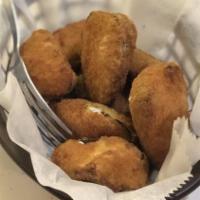 Jalapeño - Poppers · Jalapeño peppers filled with cream cheese and lightly breaded. Served with ranch dressing.