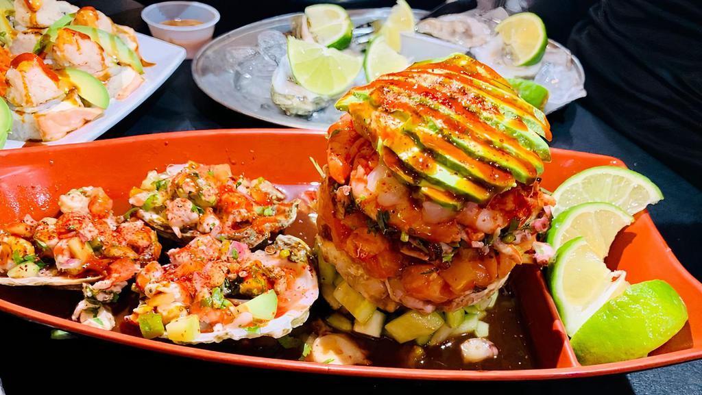 Torre De Mariscos · Seafood towards a combination of shrimp, octopus, scallops and imitation of crab meat with oysters cooked with lime, michelada juice with our jalapeño sauce.
