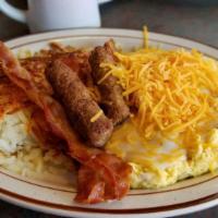 Farmer Scramble  · Two eggs scrambled with Pepper and Onion . Topped with gravy and cheddar cheese.