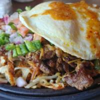 B7-Steak Breakfast Fajita · Grilled Steak served with grilled onions and peppers. With two eggs on top. Served with flou...