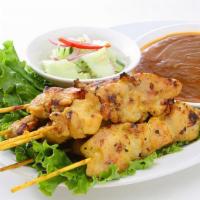 Satay (4) · Skewered marinated chicken or tofu in a mixture of thai spices. Served with peanut sauce and...