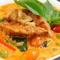 Duck Curry · Special house duck simmered with pineapple, basil, bell pepper, and tomatoes in red curry sa...