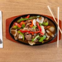 Pepper Steak · Stir-fried sliced beef with red, green bell pepper, and white onion, and in a special brown ...
