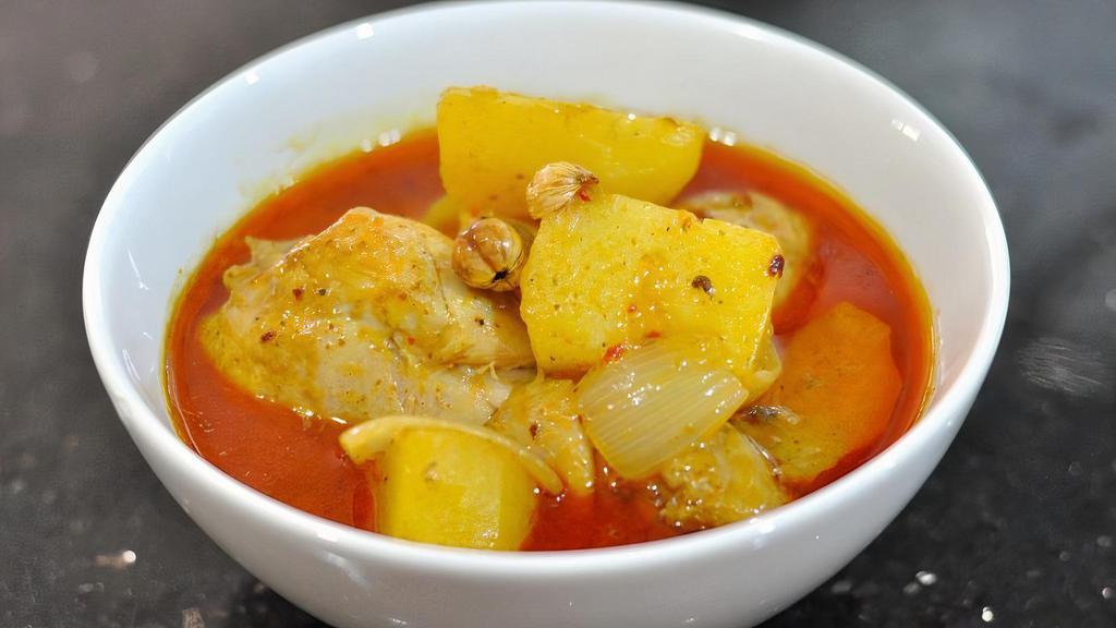 Masaman Curry · Massamun curry paste with coconut milk, peanut, and potatoes. Spicy.