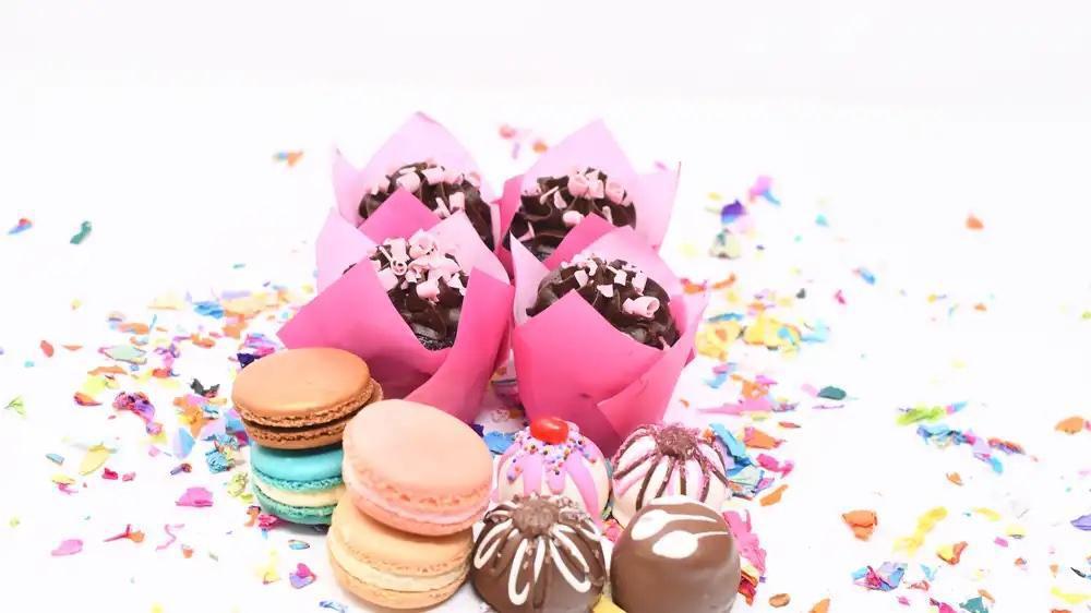Gluten Free Sampler · An assortment of our best gluten free items, includes four chocolate gluten free cupcakes made with soy, four French handmade macarons, made with almond flour, and four artisan handmade gluten free chocolates!