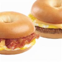 Breakfast Bagel Sandwich · Bagel sandwich with eggs, cheese, choice of protein and served with a hash brown patty or ta...