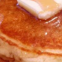 Pancake Platter · Three fluffy pancakes served with butter, syrup, two scrambled eggs, two sausage links or tw...