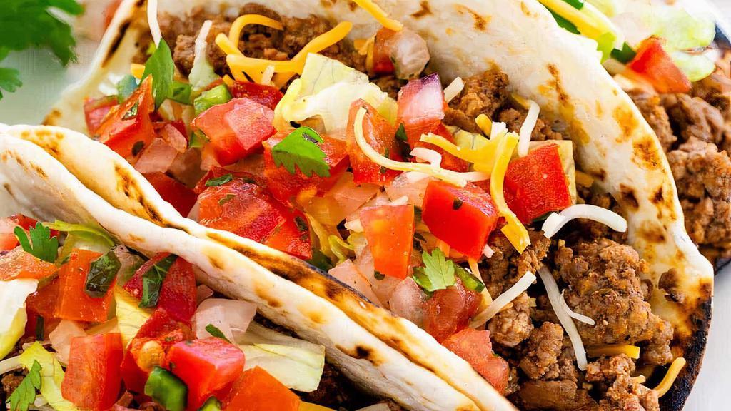 Tex-Mex Tacos (3) · Ground beef, carnitas or shredded beef, flour  tortilla or hard shell, lettuce, pico de gallo, cheese, sour cream, salsa with a side of restaurant style chips