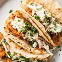 Bbq Pulled Pork Taco · Shredded bbq pork with a tangy coleslaw & cheddar cheese in a flour tortilla with french fri...