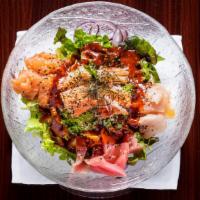 Sashimi Bibimbap · A variety of fish and special treat vegetable on top of sushi rice with house make k-sweet s...