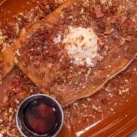 Famous Pancake · One Famous Cake made with Sweet Cream Batter, Bacon, Local Pecans, Bourbon Maple Glaze & Mas...