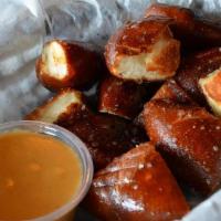 Pretzel Bites · Warm, buttery salted pretzels. Served with a side of beer cheese sauce.