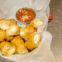 Fried Mozzarella · Fresh handmade to order Mozzarella cheese rolled in a wonton wrapper and fried golden brown....