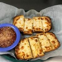 Cheesy Garlic Bread · Fresh garlic bread toasted with melted cheese to a golden brown. Served with marinara