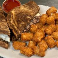 Patty Melt · Half pound beef patty topped with Swiss cheese, grilled onions and 1000 island dressing with...