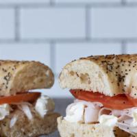 Skyline Bagel · Turkey, cream cheese, tomato, on a plain or everything bagel served hot