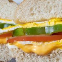 East Village · 2 eggs, American, sauteed onions, tomatoes, green peppers, on a Kaiser Roll served hot