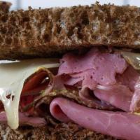 Pastrami On Rye · Double portion of pastrami, swiss, spicy mustard or russian dressing, on sliced marbled rye....