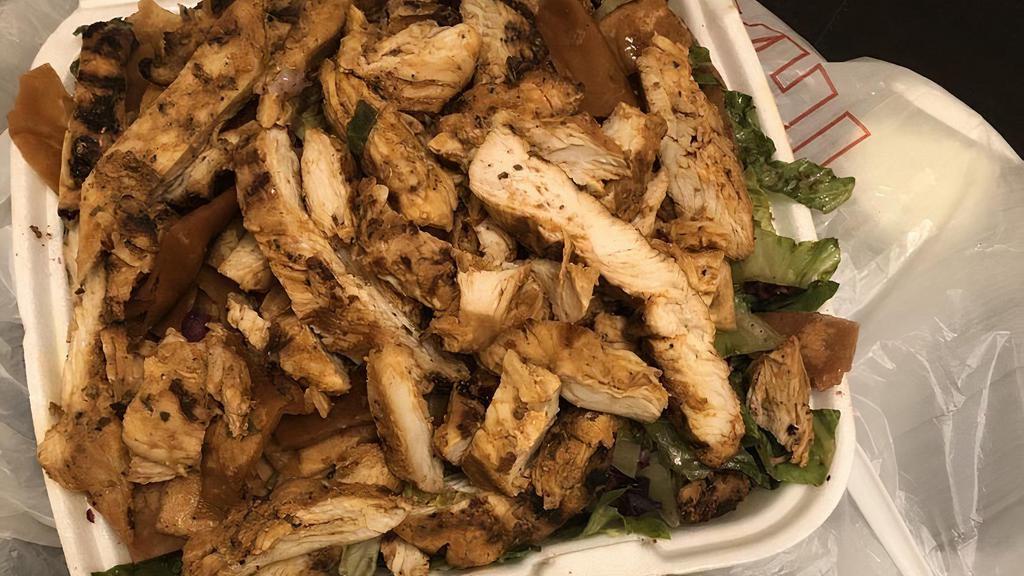 Chicken Fattoush · A blend of vegetables mixed with toasted pita bread topped with chicken.