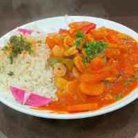 Shrimp Gallaya · Shrimp mixed with tomatoes, onions, and green peppers, and served with rice.