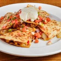 Southwest Chicken Quesadilla · Flour tortilla, seasoned chicken breast, grilled peppers & onions, mixed cheese, sour cream,...