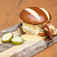 Joseph Pub · All beef seasoned burger, pretzel bun, fried onion, Cornerstone Kolsch beer cheese, spicy mu...