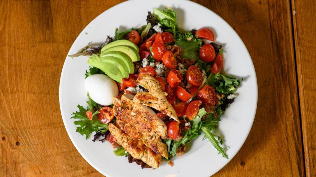 Classic Cobb  · Baby greens, grilled chicken, tomato, avocado, blue cheese crumbles, crispy bacon, hard-boiled farm egg, choice of dressing.