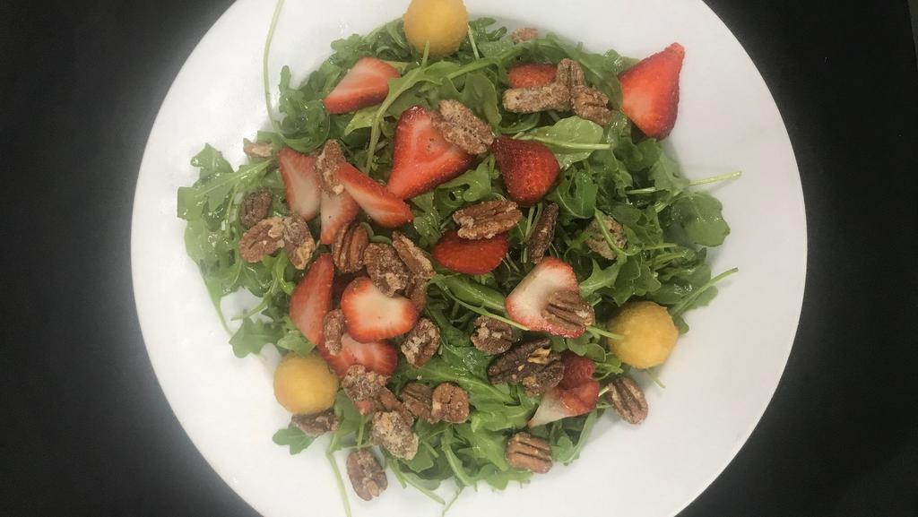 Crispy Goat Cheese  · Arugula, candied pecans, fried Capriole goat chees, strawberries, smoked balsamic vinaigrette.