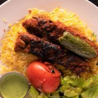 Lamb Seekh Kabob Plate (2 Pieces) · Comes with rice and your choice of sauce