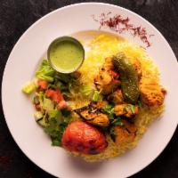 Saffron Chicken Breast · Comes with rice and your choice of sauce