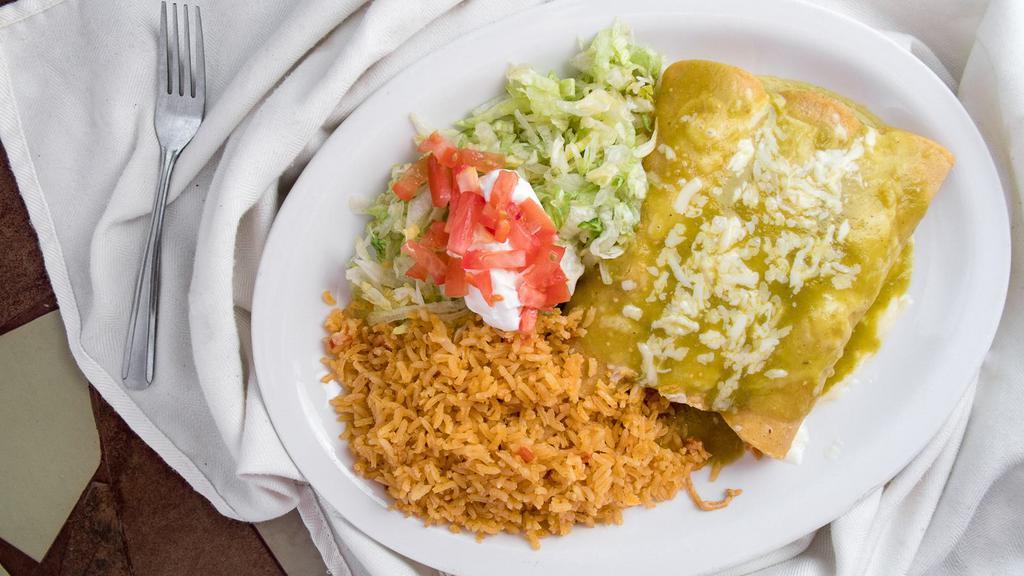 Enchiladas Suizas · Three enchiladas with your choice of chicken, beef tips or cheese. Topped with fresh green tomatillo sauce. Served with Mexican rice, lettuce, sour cream, and tomato.