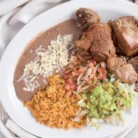 #36. Carnitas · Delicious roasted pork tips. Served with Mexican rice, refried beans, pico de gallo guacamol...
