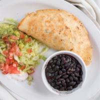 Quesadilla Mexicana · Grilled flour tortilla spread with fried beans, cheese and stuffed with beef tips or chicken...