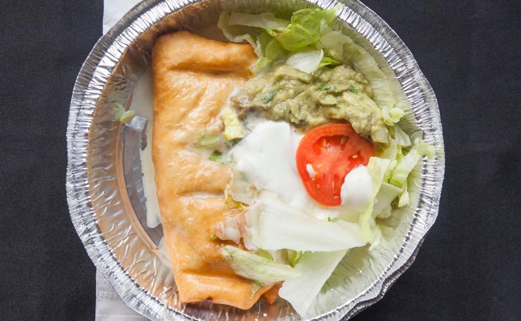 Chimichanga · (Deep fried burrito) beef or chicken with cheese sauce on top and lettuce, sour cream, guacamole and tomato on the side.