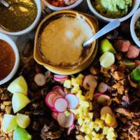 Discada · Serves 2 people.
A platter of grilled meats for street tacos on char roasted peppers and oni...