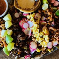 Grande Fiesta  · For 8 people. Same as discada, but bigger!
A platter of grilled meats for street tacos on ch...