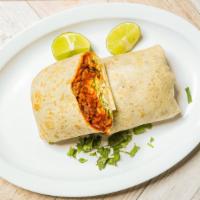 Burrito De Pastor · Marinated pork burrito all wrapped up with beans, cheese, lettuce, tomato, and sour cream.