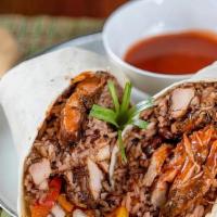 Jerk Chicken Burrito · Jerk Chicken,rice & beans, sauteed peppers and onions, signture sauce, wrapped in a flour to...