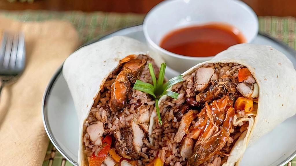 Jerk Chicken Burrito · Jerk Chicken,rice & beans, sauteed peppers and onions, signture sauce, wrapped in a flour tortilla