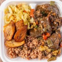Brown Stewed Chicken Bowl · Browned Stewed Chicken,rice & beans, sauteed mixed vegetable and fried plantains