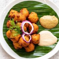 Punugulu · Punugulu is a deep fried snack made with rice, urad dal and other spices.