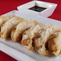 Pot Sticker Shrimp (6) · Deep-fried shrimp dumplings served with house soy sauce.