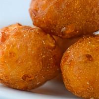 Corn Fritters · Sweet, savory and satisfying. About 9 per order.