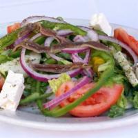 Greek Salad · Romaine, green peppers, onions, feta, olives, pepperoncini, anchovies, tomatoes, cucumbers, ...