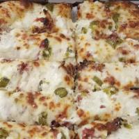 Jalapeno Popper Bread · Fresh baked bread with our garlic cheese dip spread & topped with fresh jalapenos, crispy ba...